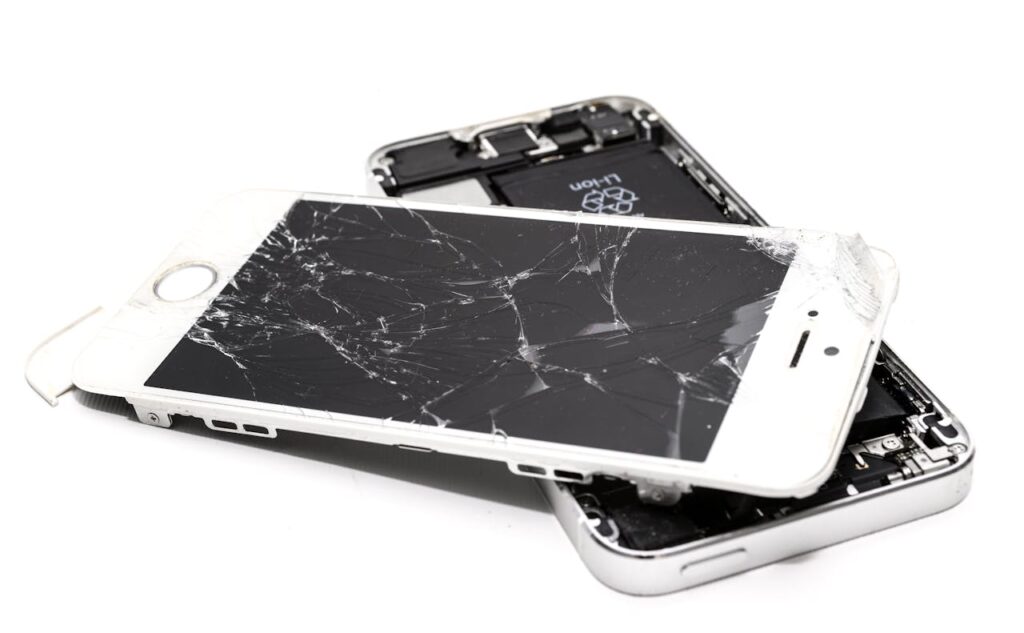 a broken cell phone on top of each other